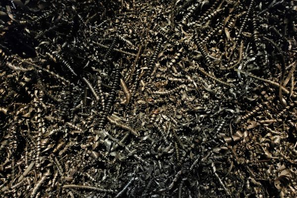 pexels-photo-17887900-17887900 Detailed close-up of a heap of twisted metal shavings, showcasing a complex texture.