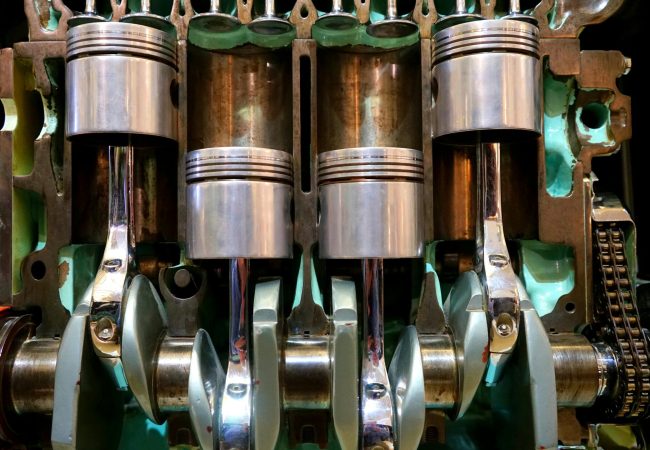 pexels-photo-190539-190539 Close-up image of car engine pistons and crankshaft, showcasing mechanical components.